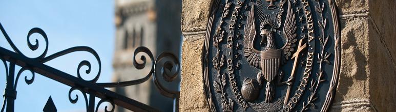 Georgetown University seal on front gate pillar