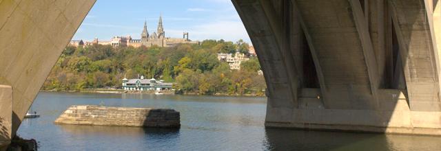 View of Healy Hall from the Potomac River, under the Key Bridge